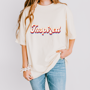 Woman wearing Inspired Women's Garment-Dyed T-Shirt in ivory, soft cotton, casual wear, stylish & durable, perfect gift, 10 vibrant colors